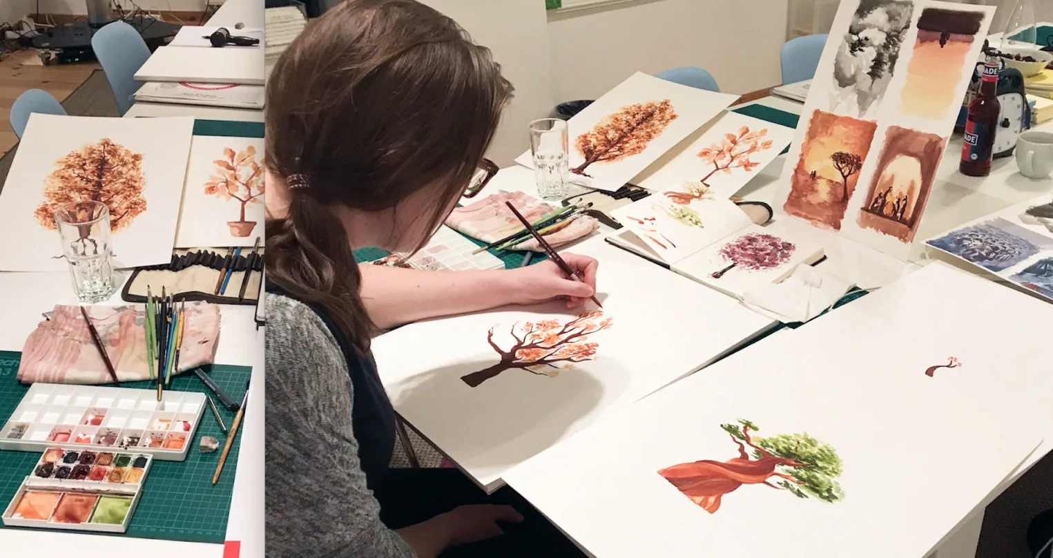 Sarah painting backgrounds in watercolor